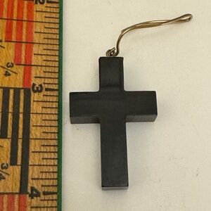 Shiny black cross with gold finding